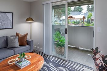 Living room with sliding glass door to balcony